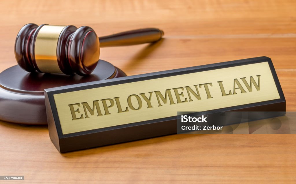 A gavel and a name plate with the engraving Employment Law Employment And Labor Stock Photo