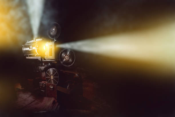 istock old film projector with smoke in dark room background 692791148