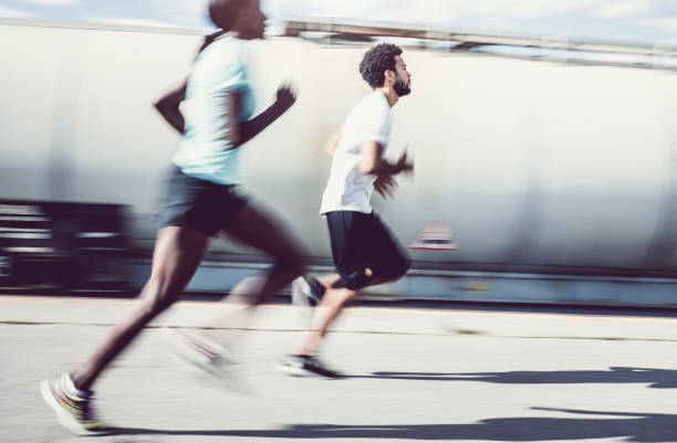 istock Two Athlete's Running Outdoors, Blurre motion 692791158