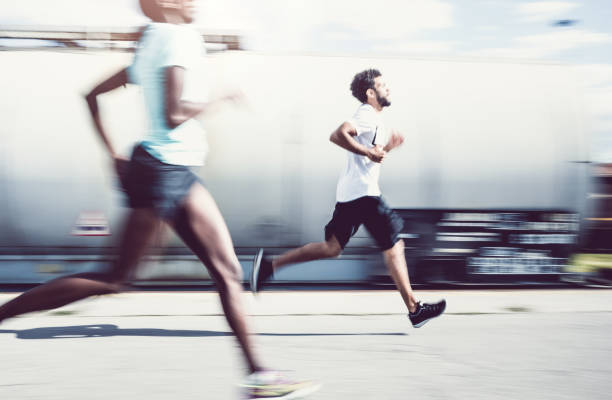 istock Two Athlete's Running Outdoors, Blurre motion 692791178