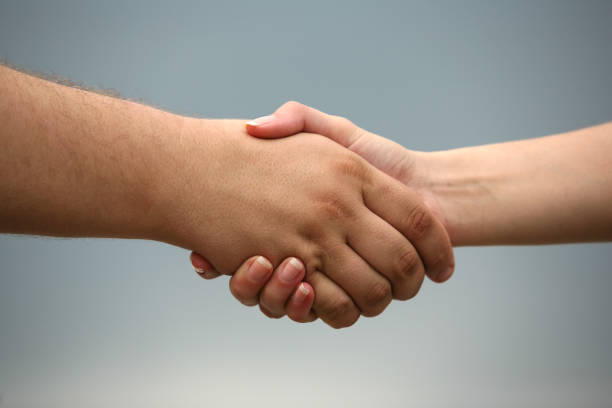 istock Business handshake on a blue background 692793624