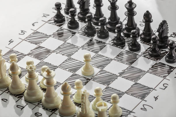 istock Chess. Whites are starting. White board with chess figures on it. Plan of battle. 692798362