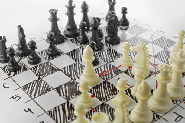 istock Chess, white's attack. White board with chess figures on it. Plan of battle. 692800660