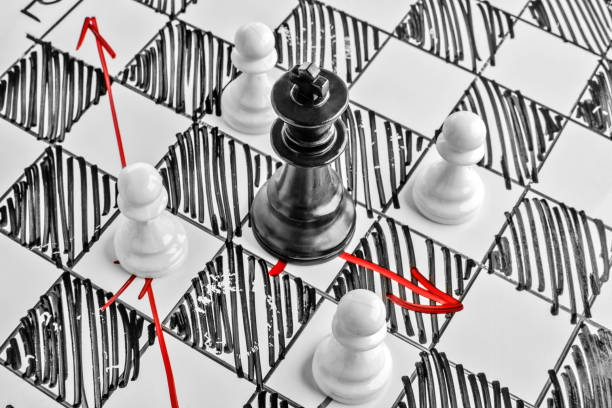 istock Chess. The black King is under attack. White board with chess figures on it. Helpmate or checkmate. 692801374