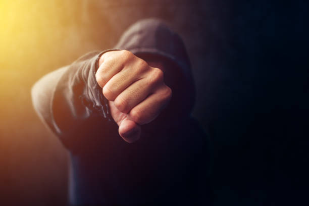 Hand of young male boxer wrapped in protective bandage.