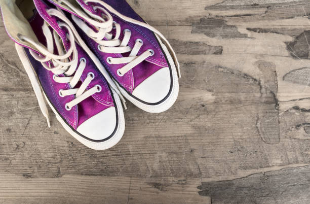 istock Sneakers on an old wooden surface. 692806534