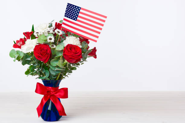 Beautiful bouquet with american flag on white background