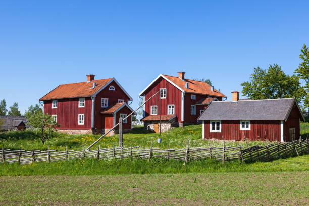 Historic village with ancient red wooden houses in Sweden