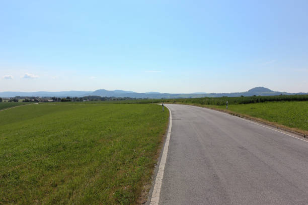 istock road in summer landscape 692816602