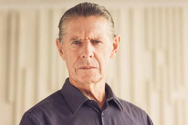 istock Frown Serious Angry Senior Man Looking at Camera 692818792