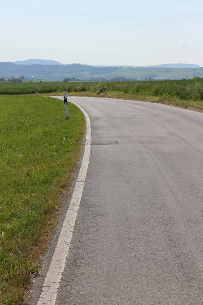 istock road in summer landscape 692818906