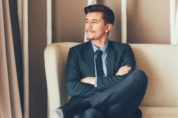 istock Thoughtful Businessman Sitting in Office Lobby 692818912