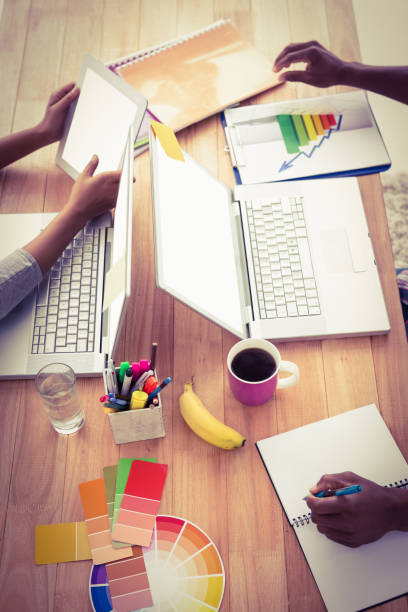 istock Young business people working at the laptops 692819028