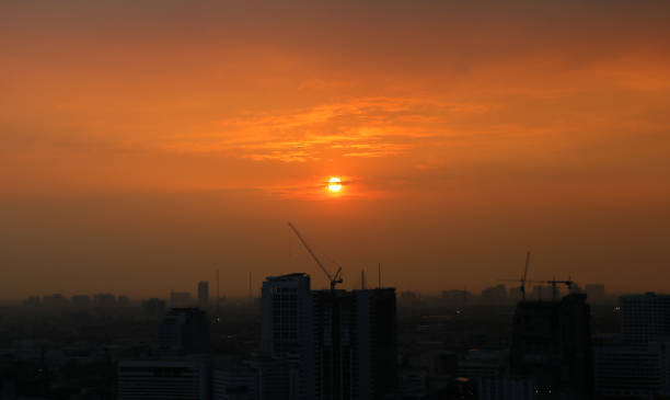 istock Sunset and clouds background in the evening, city downtown with sunset sky. 692819046