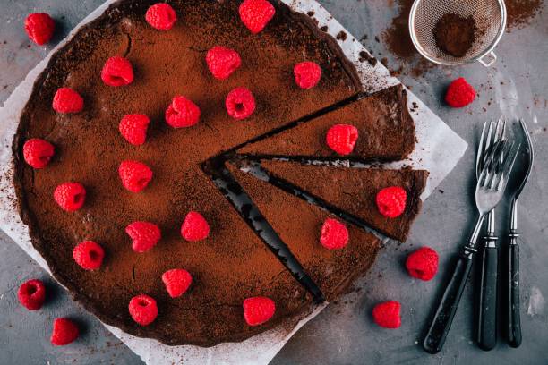istock Chocolate tart with raspberries 692819282