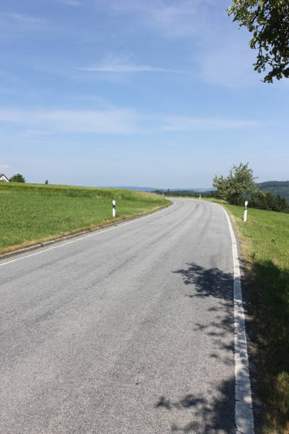 istock road in summer landscape 692819368