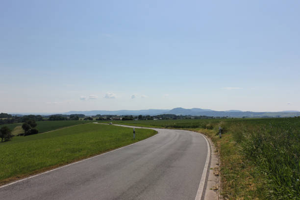 istock road in summer landscape 692819466