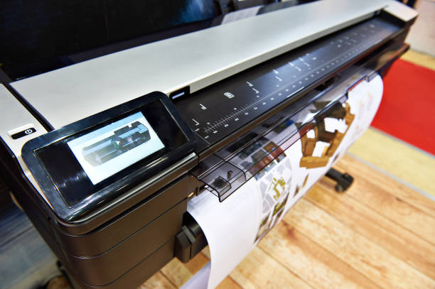 Large format printing Large format printing on a color plotter printing out stock pictures, royalty-free photos & images