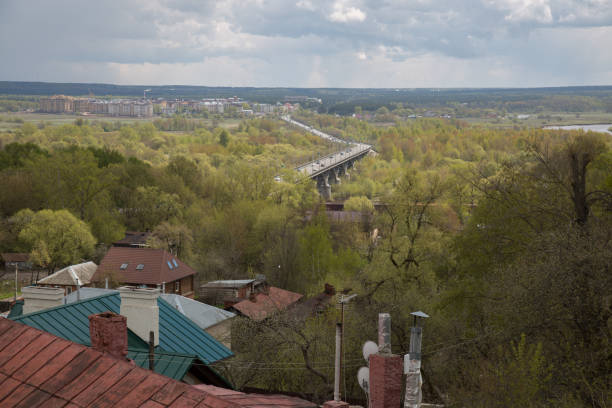 istock Rural landscape roofs bridge transport 692838750