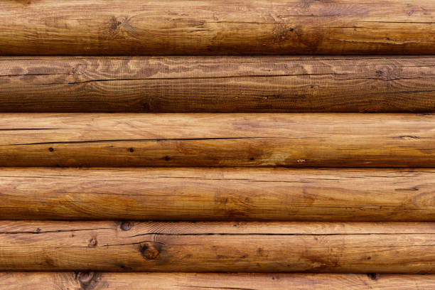istock Wooden wall from logs as a background. 692841730
