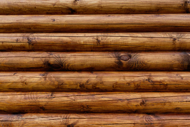istock Wooden wall from logs as a background. 692841864