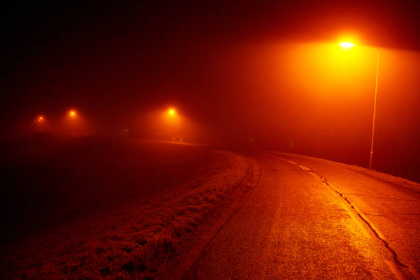 istock night road lit by streetlamps 692844466