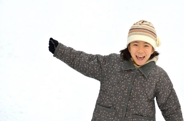 Full Length Of Cute Girl In Snow On Land During Winter