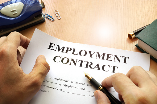 Employment contract on an office table. Recruitment concept.