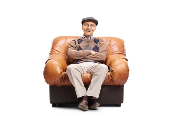 istock Elderly man sitting in a leather armchair 692849344