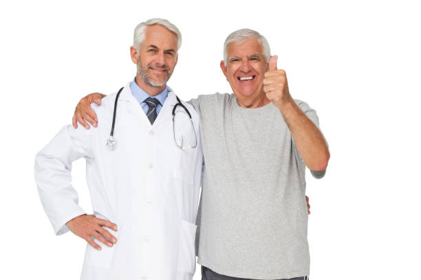 年配の男性ジェスチャー親指とドクターの肖像 - doctor portrait adult male ストックフォトと画像