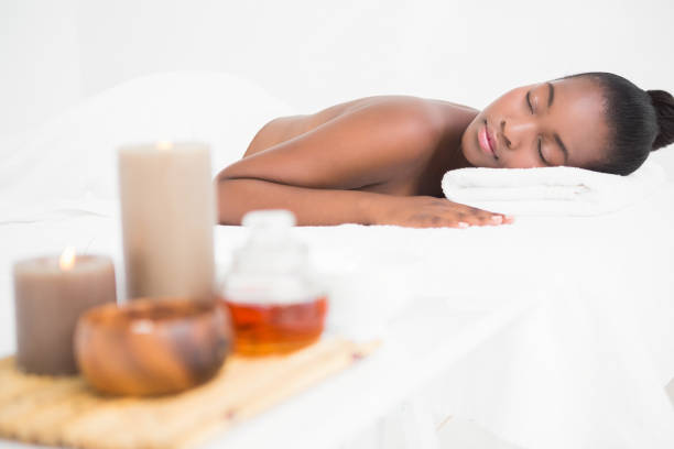 istock Peaceful pretty woman lying on massage table 692856272