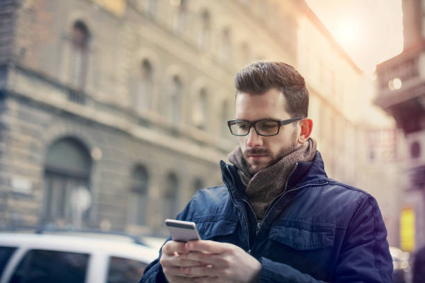 istock Young man with his smart phone 692858436