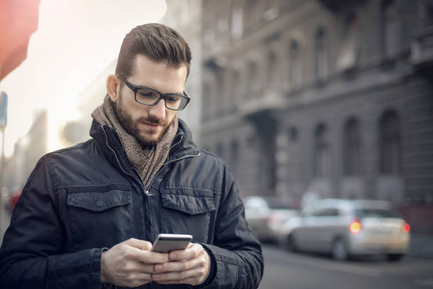 istock Young man with his smart phone 692858626