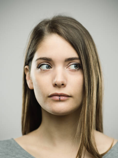 istock Real curious young woman studio portrait 692862606