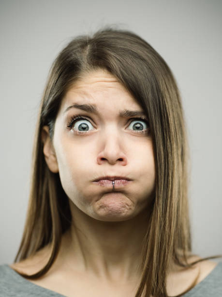 istock Real young woman with disgust expression 692863128
