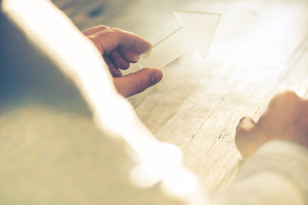 istock Businessman holding a transparent arrow up 692863216