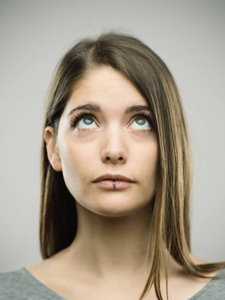 istock Real curious young woman studio portrait 692863232