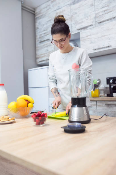 istock Young woman making a healthy breakfast 692868848