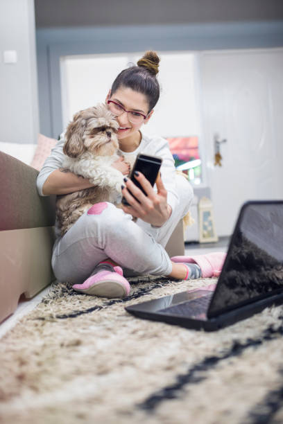 istock Young woman with cute dog 692869822