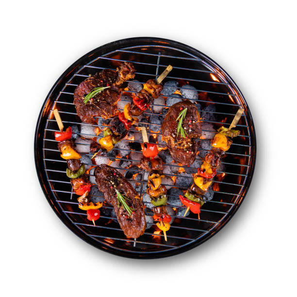 istock Fresh raw beef steaks placed on grill, isolated on white background 692872830