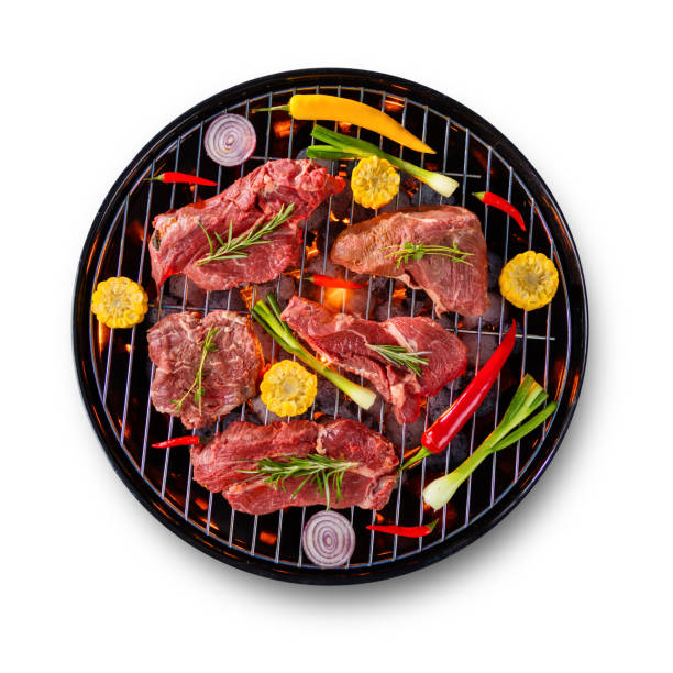 istock Fresh raw beef steaks placed on grill, isolated on white background 692872878