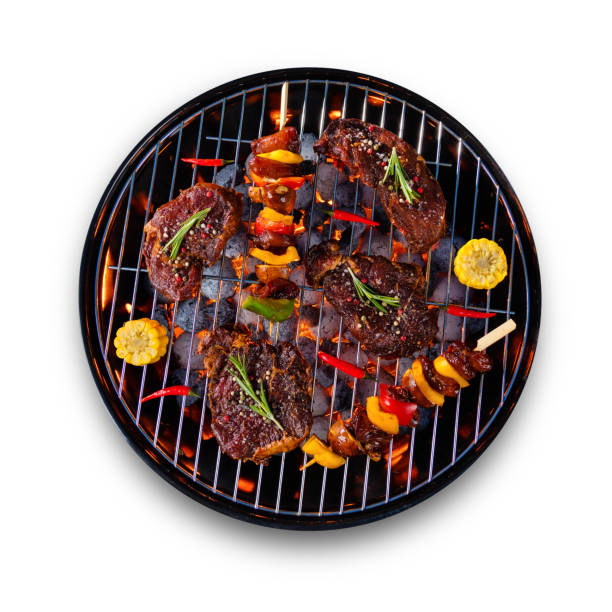 istock Fresh raw beef steaks placed on grill, isolated on white background 692872946