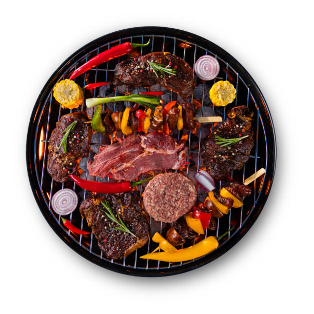 istock Fresh raw beef steaks placed on grill, isolated on white background 692873004