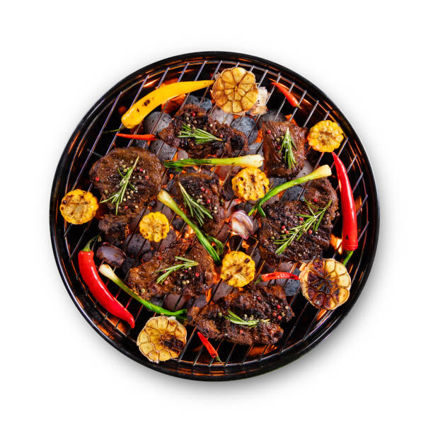 istock Fresh raw beef steaks placed on grill, isolated on white background 692873100