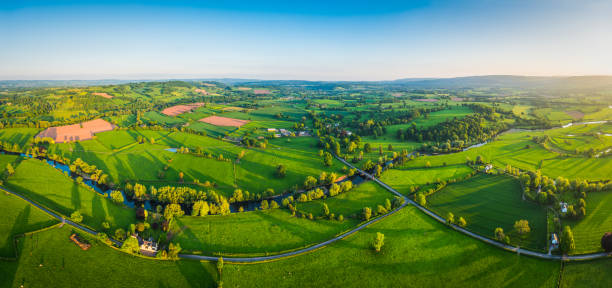 aerial panorama over vibrant green countryside idyllic rural pasture farmland - river usk imagens e fotografias de stock