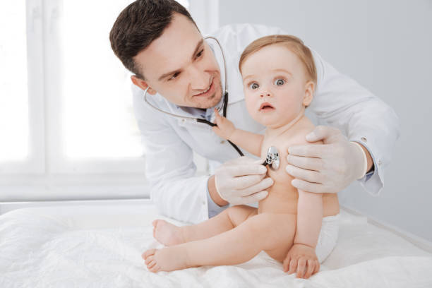 istock Great doctor making sure his adorable patient being healthy 692876894