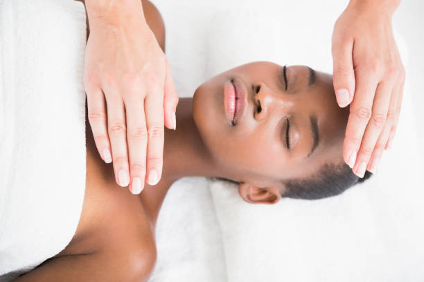 istock Pretty woman enjoying a reiki technique 692880494