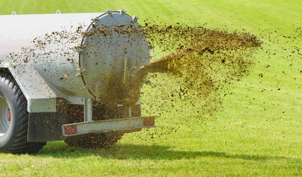 istock fertilization with tractor and liquid manure in Bavaria, Germany 692883210