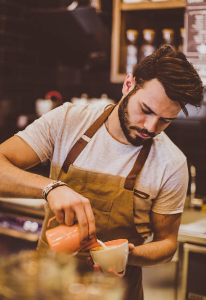 istock Young Barista Pouring Latte Art 692888690