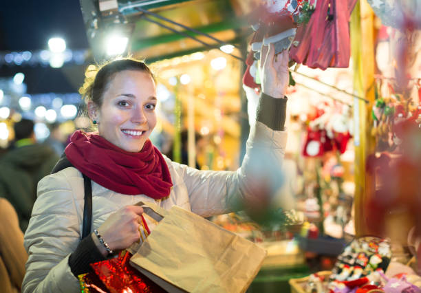 istock Woman at Christmas fair in evening 692888802